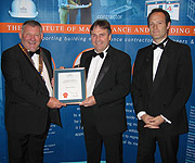 Mike Parrett and Series Producer, Anthony Levene receiving their award from Steve Dunford FIMBM, IMBM President